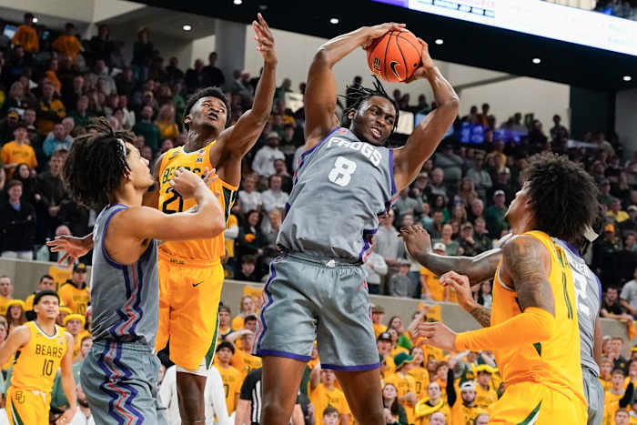 Jan 27, 2024; Waco, Texas, USA; TCU Horned Frogs center Ernest Udeh Jr. (8) grabs the rebound against the Baylor Bears during the second half at Paul and Alejandra Foster Pavilion. Mandatory Credit: Raymond Carlin III-USA TODAY Sports